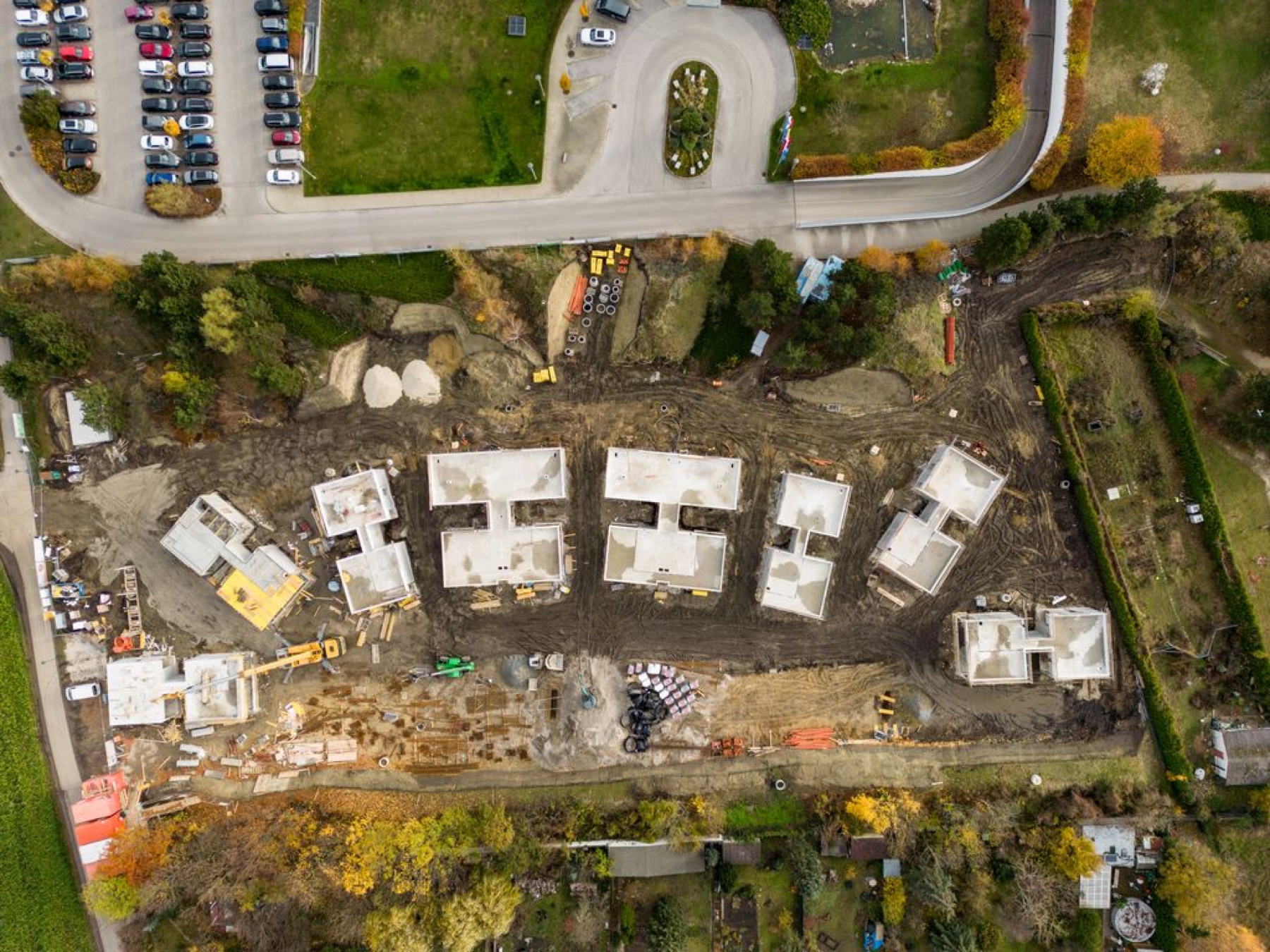 Top-down drone shot of a residential construction site with foundation slabs — Best Alex Shots